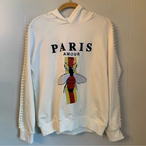 Beautiful white hoodie with Pearl detail on the sleeves